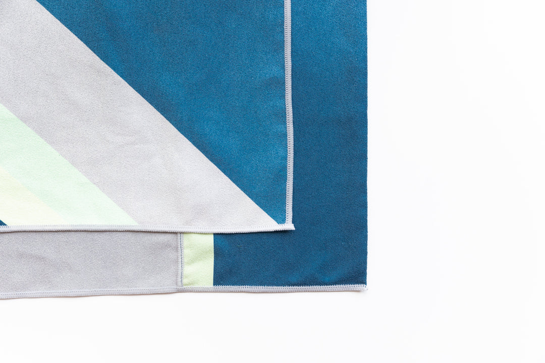 Highly absorbent, quick dry, Sand repellent, Lightweight, Australian owned & designed, Made from 8 recycled bottles, Car Hooded, zipped accessory pocket, premium beach towel, gym towel.