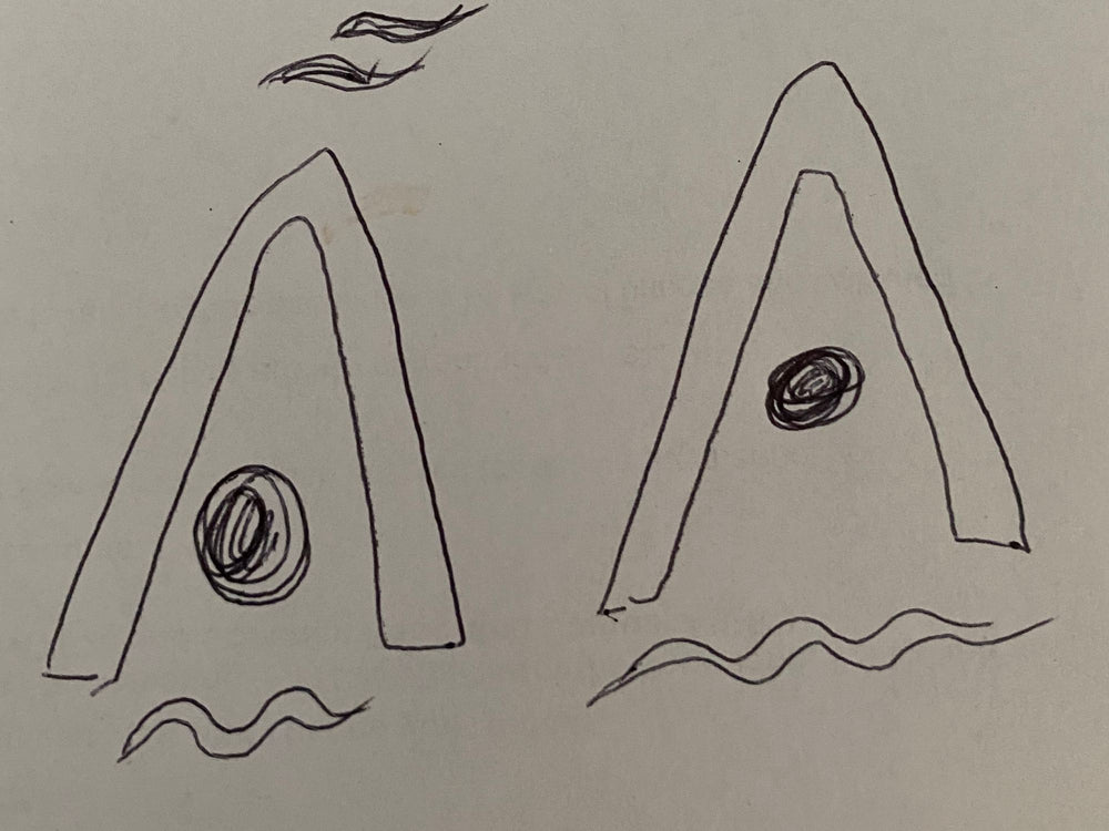 Early hand sketches of the A logo with waves