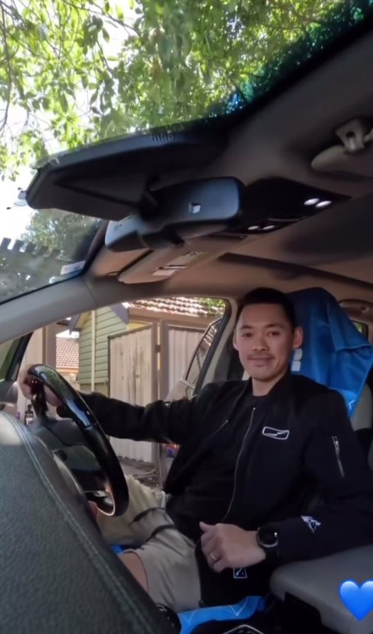 A custom branded Actv8 car seat towel being fitted over a car seat