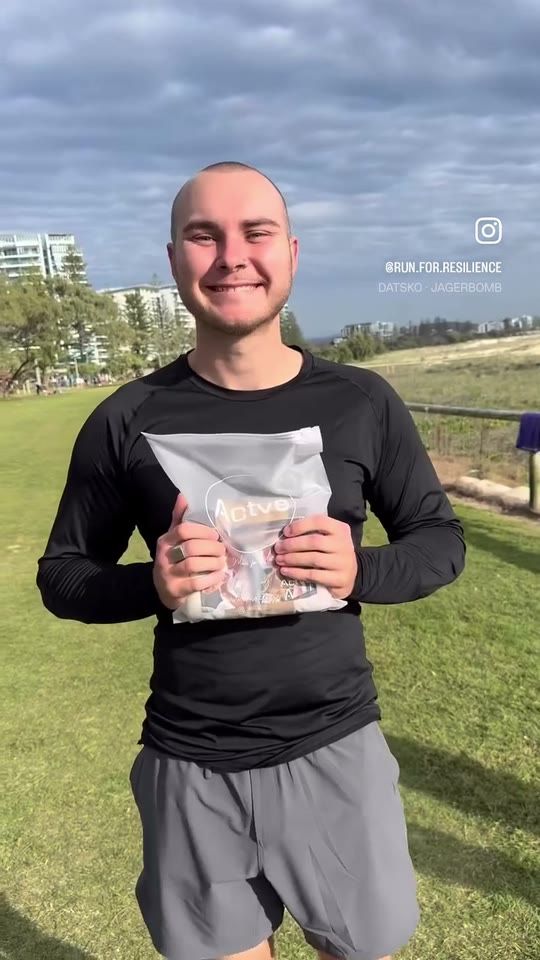 Actv8 finish line giveaway at a beach run club, runners holding up their Actv8 packs