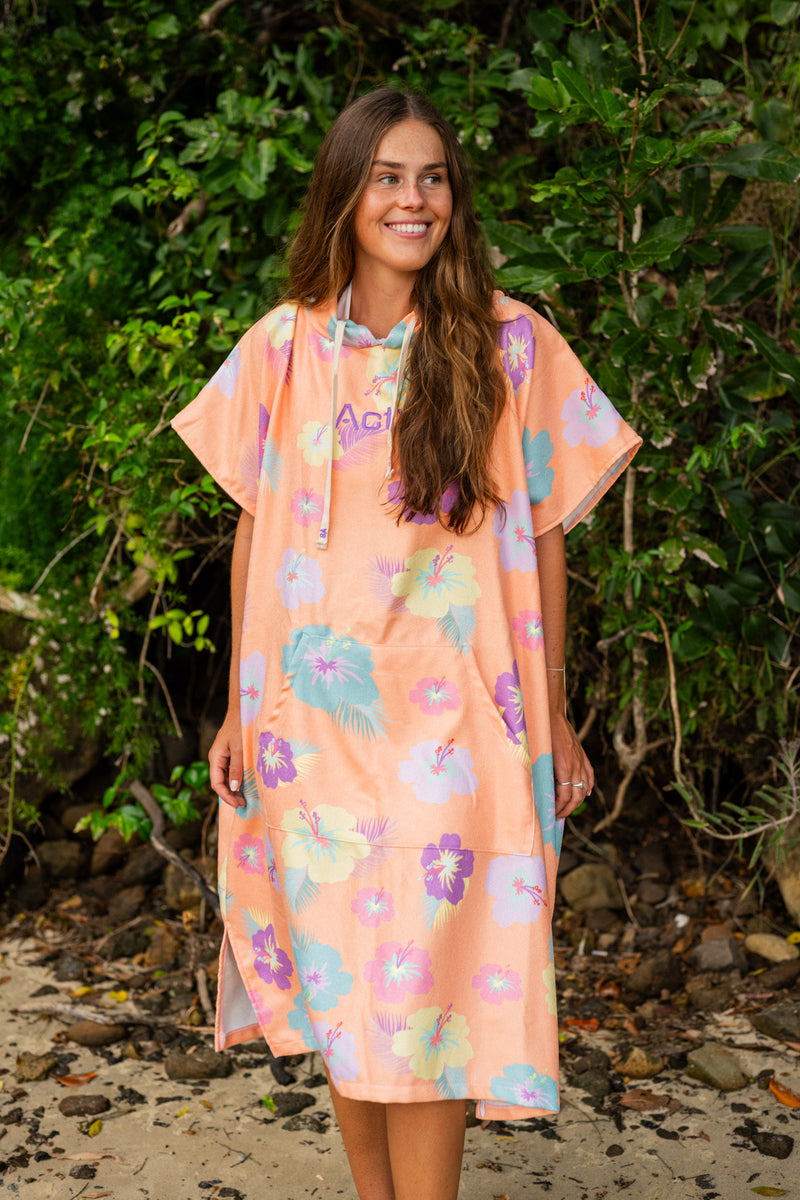 Changing Poncho in Lani among the trees