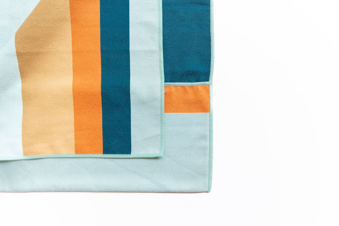 Highly absorbent, quick dry, Sand repellent, Lightweight, Australian owned & designed, Made from 8 recycled bottles, Car Hooded, zipped accessory pocket, premium beach towel, gym towel.