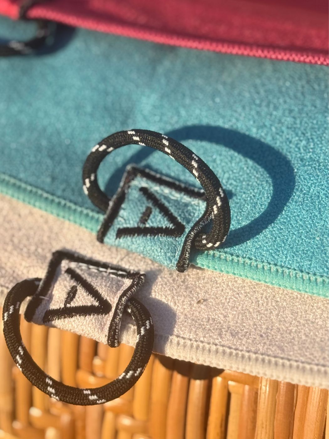 Rope hang loops with the A tag on the Hoodless Gym Towel