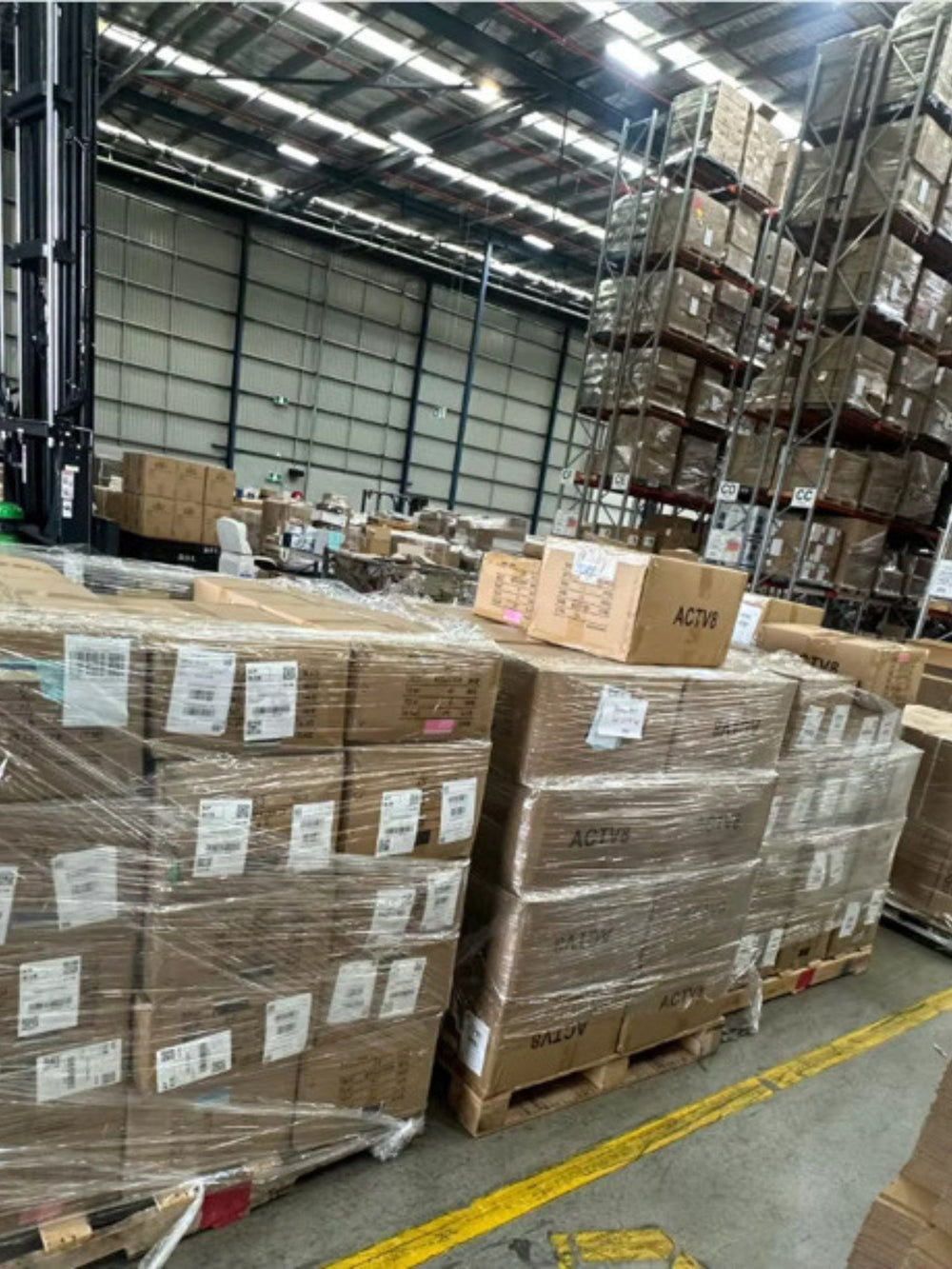 Shrink-wrapped pallets of Actv8 cartons arriving at the warehouse